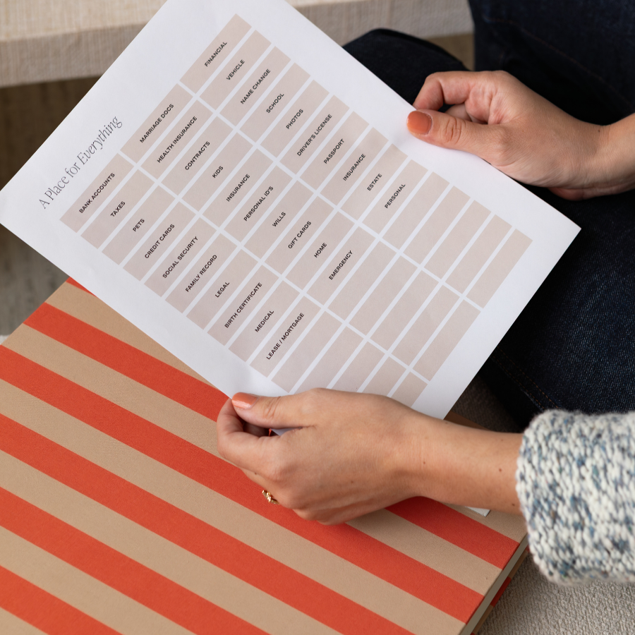Person holding a printed checklist on a striped box