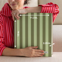 Person holding a green striped DailyDocs organizer with measurements and a brand label.