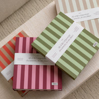 Striped document organizers on a textured surface