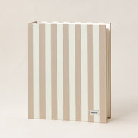 Document organizer with stipe branding on a beige background