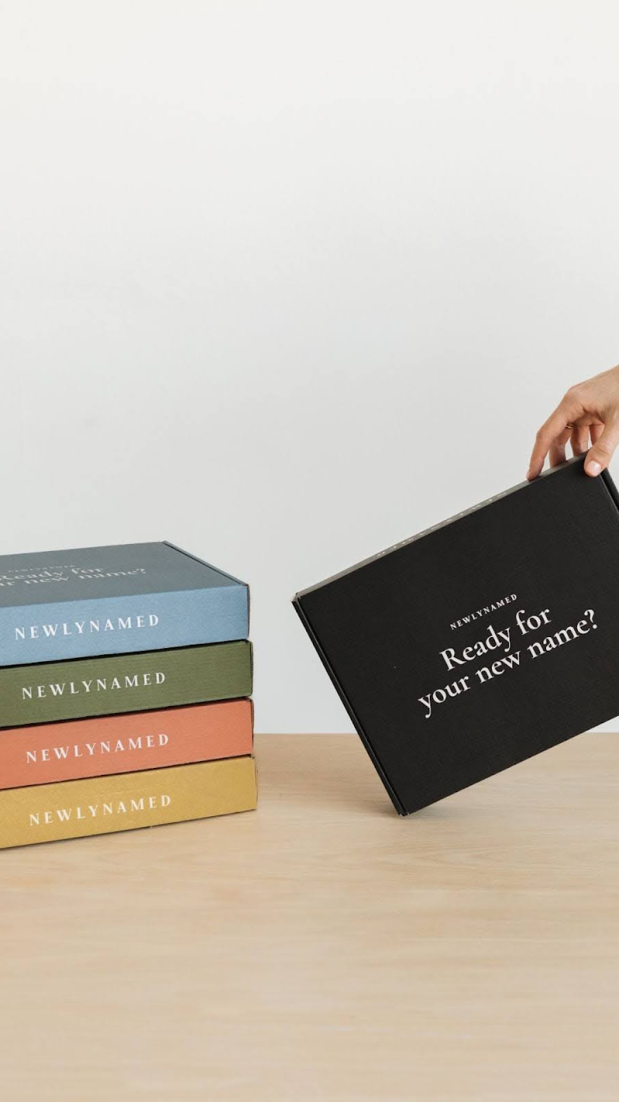 Person Holding NewlyNamed Box