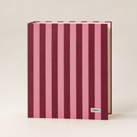 Document organizer with pink and purple vertical stripes on a beige background