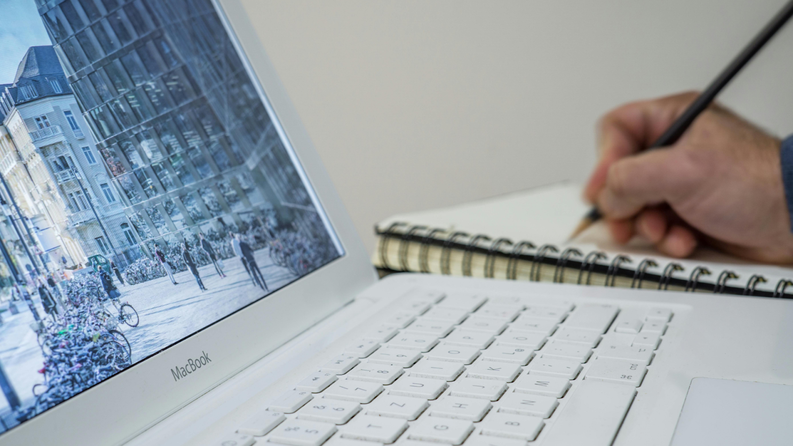 A Person Organizing Important Documents Online And On Paper