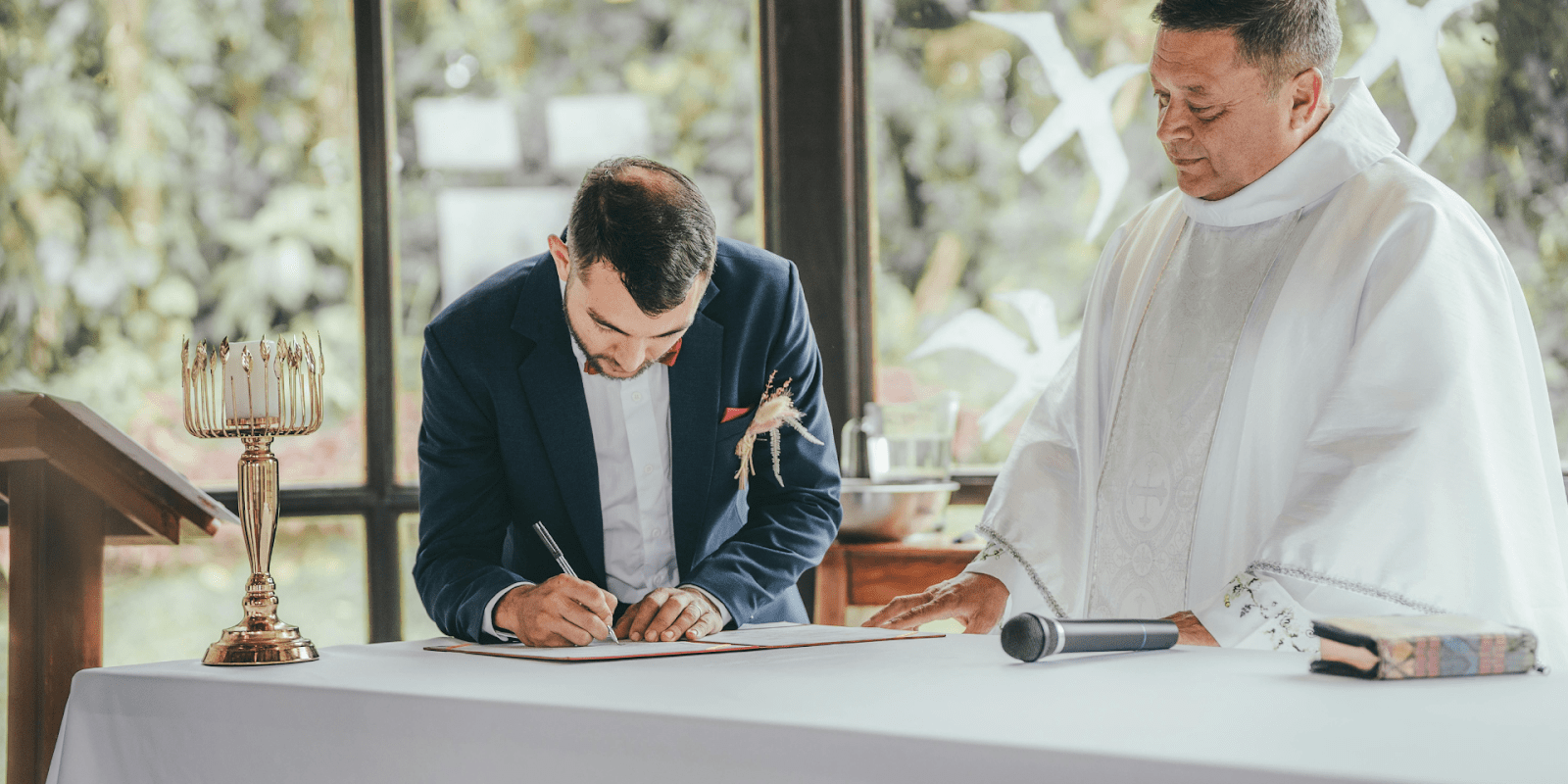 Marriage Officiant Observing Groom Signing Marriage License