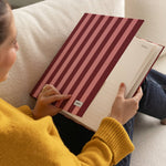 DailyDocs document organizer in Sangria striped design shown open with interior pages