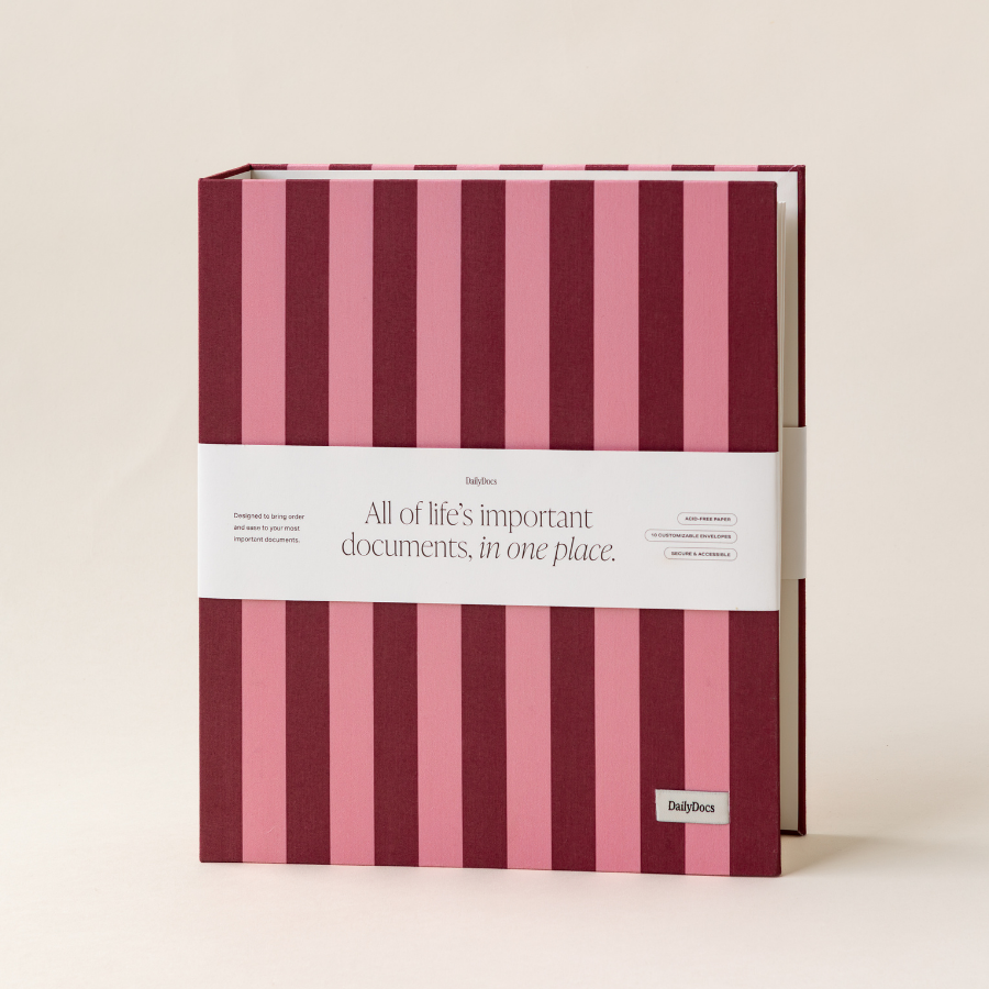 Striped document organizer with pink and red vertical stripes on a beige background