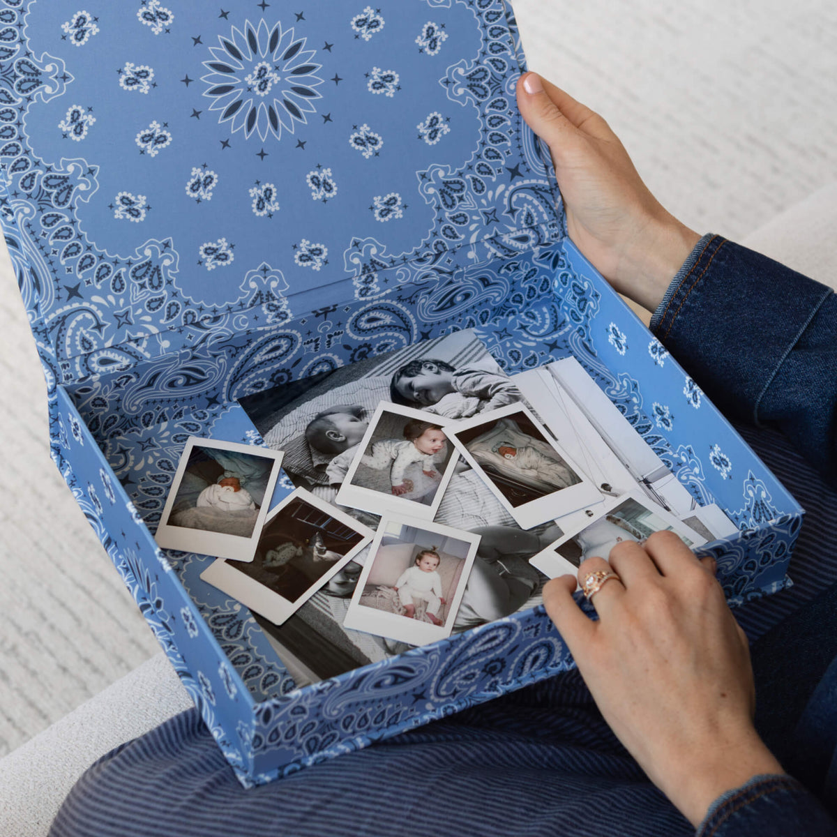 A person holding a Bandana Blue DailyDocs Keepsake Box.