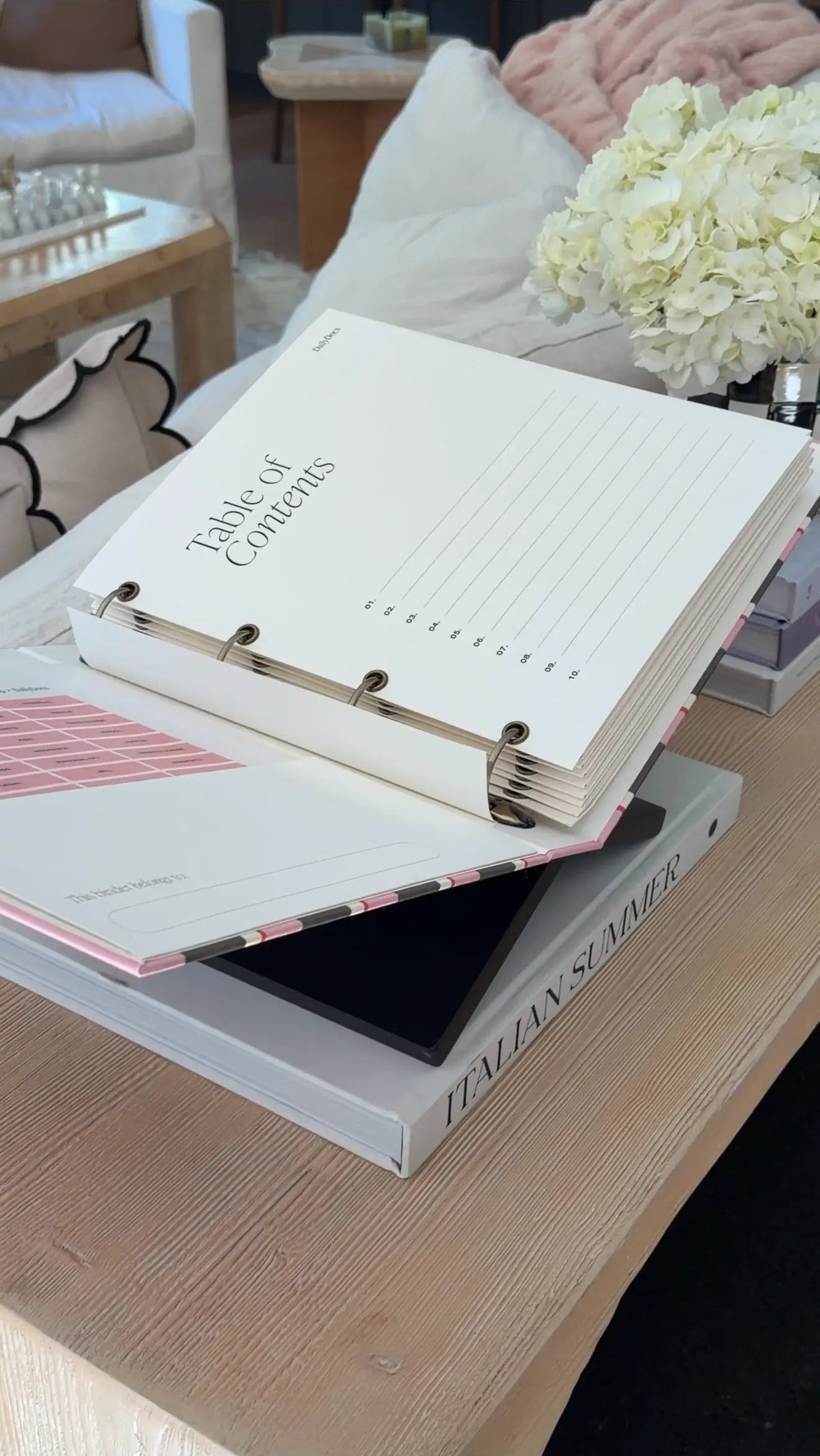 Kristen Hollingshaus holding the HausKris x DailyDocs document organizer