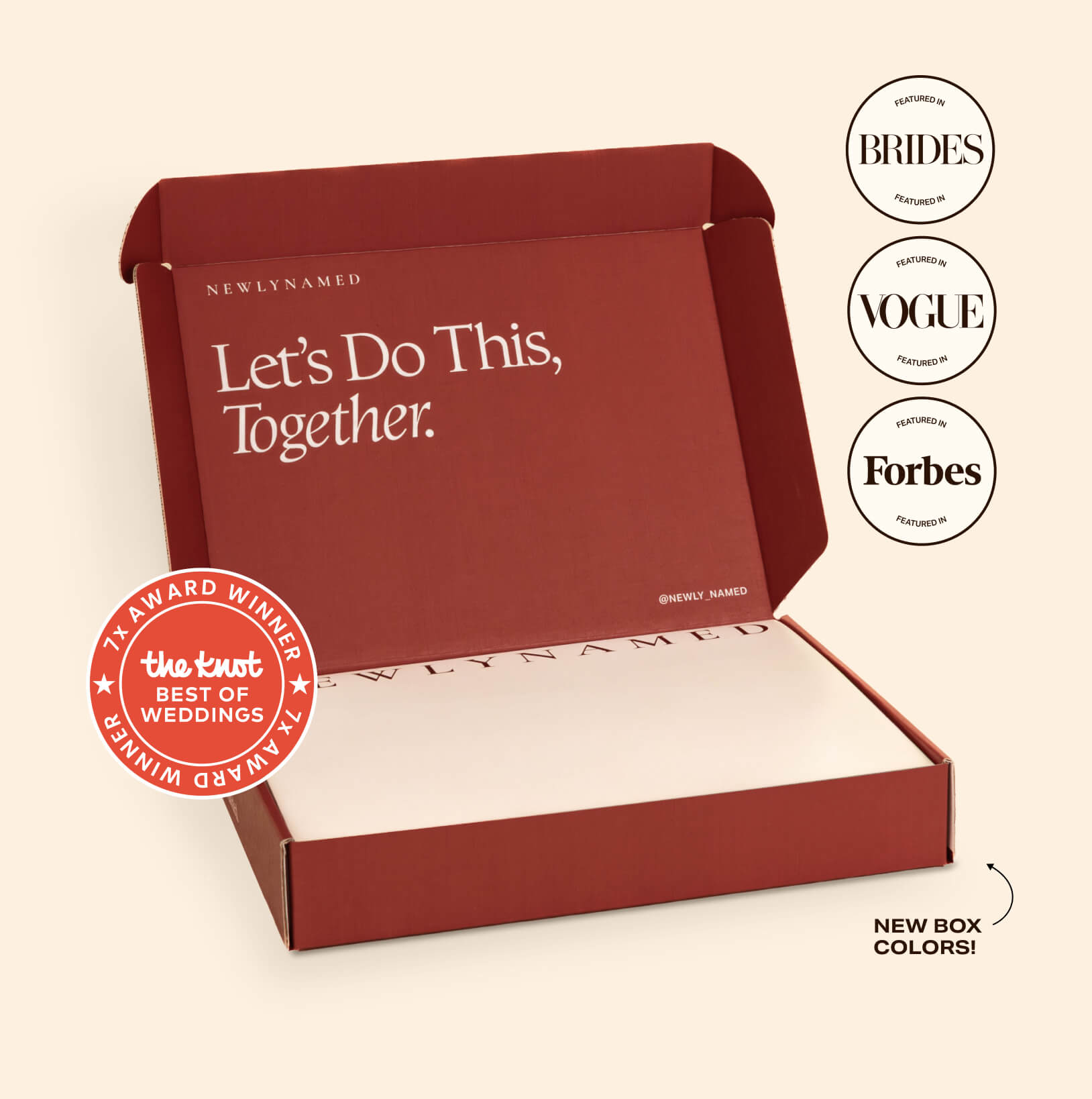 An open deep red NewlyNamed Box premium name change service kit with the inner lid reading Let's Do This, Together.